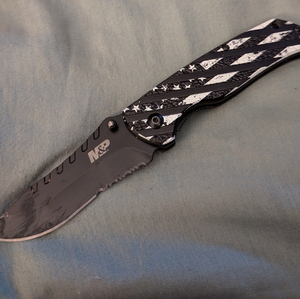 Black and White Tactical Folding Knife with Textured Handle